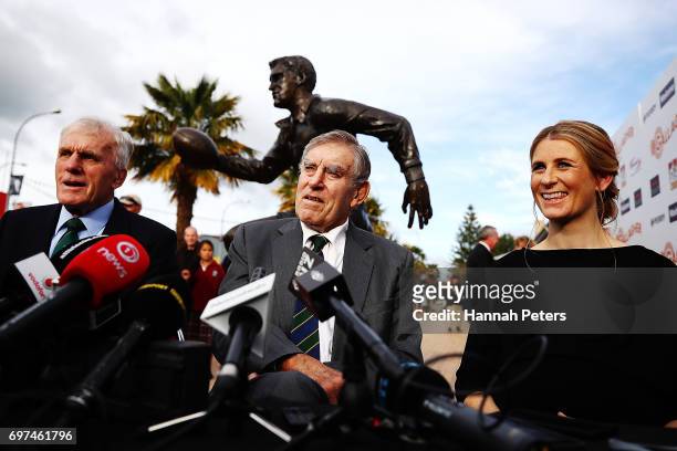 Former All Blacks players Stan Meads and Sir Colin Meads speak with artist Natalie Stamilla after the unveiling of a new statue on June 19, 2017 in...