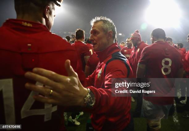 Rob Howley, the Lions backs coach congratulates Anthony Watson after their victory during the match between the New Zealand Maori and the British &...