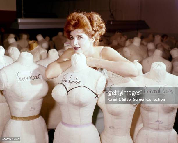 American actress and singer Tina Louise with a collection of mannequin busts, including ones of herself, Sophia Loren, Inger Stevens and Carolyn...