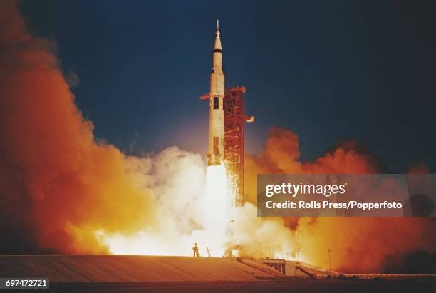 View of a Saturn V rocket blasting off during launch from Kennedy Space Center, carrying the Apollo 8 crew of NASA astronauts, Commander Frank...