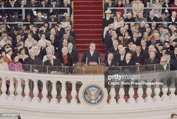 Recently elected 37th President of the United States, Richard Nixon delivers his inaugural speech from a podium during the inauguration ceremony in...