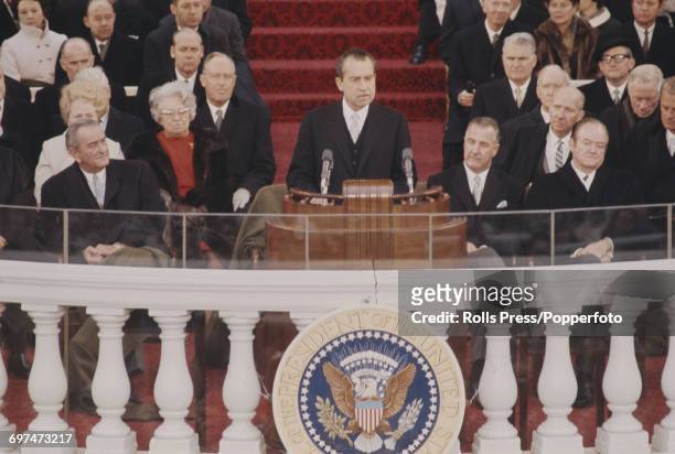 Recently elected 37th President of the United States, Richard Nixon delivers his inaugural speech from a podium during the inauguration ceremony in...