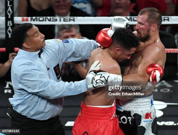 Referee Tony Weeks separates Andre Ward and Sergey Kovalev in the fourth round of their light heavyweight championship bout at the Mandalay Bay...