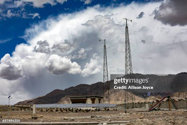 Solar-wind hybrid system is seen at the site of what will be a solar energy park built by the Ladakh Renewable Energy Development Agency in Leh on...