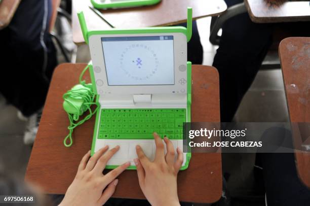 Student works with his OLPC XO laptop at the Nuestra Senora del Rosario Catholic School in San Marcos, 5 km south from San Salvador, El Salvador, on...