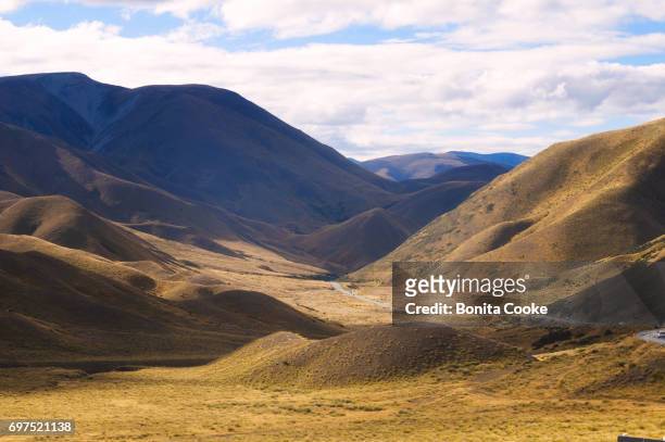 lindis pass between cromwell and omarama - otago stock pictures, royalty-free photos & images
