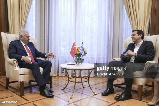 Prime Minister of Turkey Binali Yildirim speaks with Prime Minister of Greece Alexis Tsipras during their meeting, in Athens, Greece on June 19, 2017.