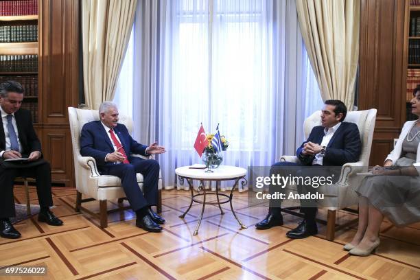 Prime Minister of Turkey Binali Yildirim speaks with Prime Minister of Greece Alexis Tsipras during their meeting, in Athens, Greece on June 19, 2017.