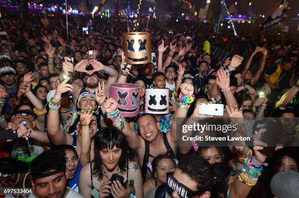 Fans react during a performance by DJ/producer Marshmello during the 21st annual Electric Daisy Carnival at Las Vegas Motor Speedway on June 18, 2017...