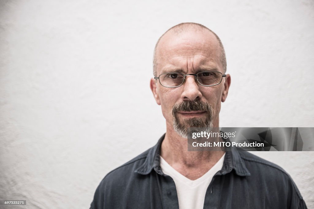 Portrait of a suspicious mature man, Munich, Bavaria, Germany