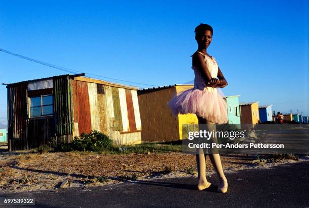 U2013 JANUARY 30: Noluyanda Mqutwana, a ballet student, stands outside her small family house on January 30, 2000 in Khayelitsha, the biggest black...