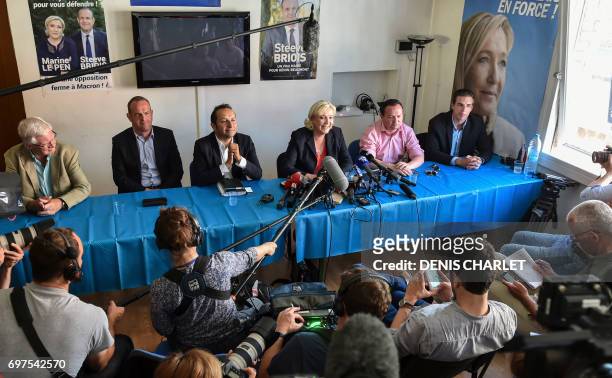 France's far-right National Front leader and newly elected member of Parliament Marine Le Pen gives a press conference next to FN's new elected MP,...