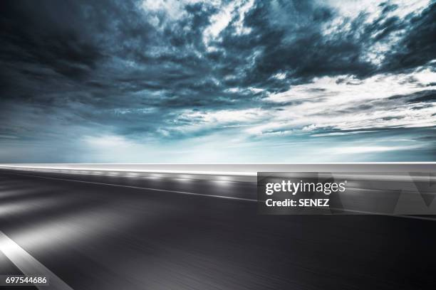 traffic on road at night - empty road stock pictures, royalty-free photos & images