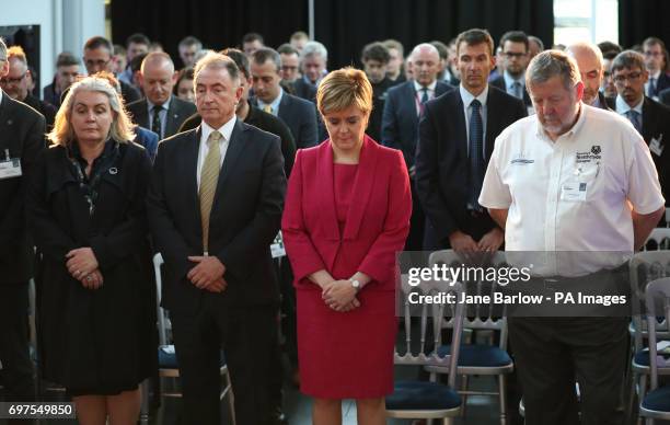 First Minister Nicola Sturgeon observes a minute's silence during a visit to the Advanced Forming Research Centre in Renfrew, Glasgow, in memory of...