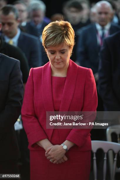 First Minister Nicola Sturgeon observes a minute's silence during a visit to the Advanced Forming Research Centre in Renfrew, Glasgow, in memory of...