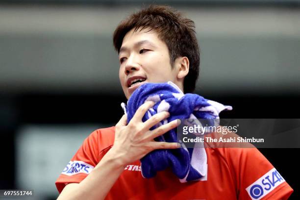 Jun Mizutani of Japan reacts during the men's singles semi final match against Zhendong Fan of China on day five of the 2017 ITTF World Tour Platinum...