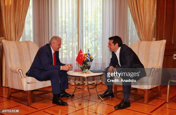 Prime Minister of Turkey Binali Yildirim speaks with Prime Minister of Greece Alexis Tsipras during their meeting, in Athens, Greece on June 19, 2017.