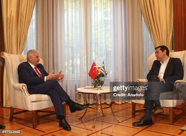 Prime Minister of Turkey Binali Yildirim speaks with Prime Minister of Greece Alexis Tsipras during their meeting, in Athens, Greece on June 19, 2017.