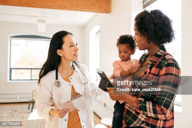 visiting a doctor - visit stock pictures, royalty-free photos & images