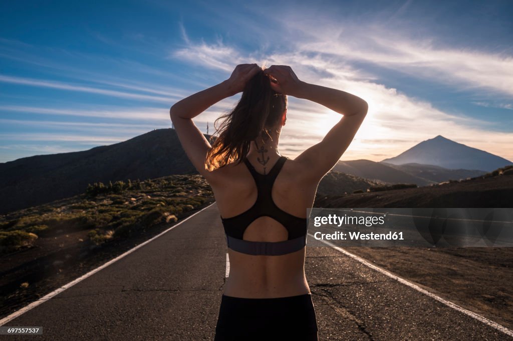 Young woman training on empty street