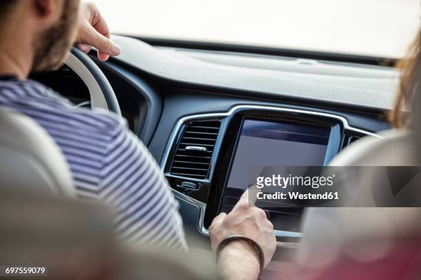 couple driving in car - car stereo stock pictures, royalty-free photos & images