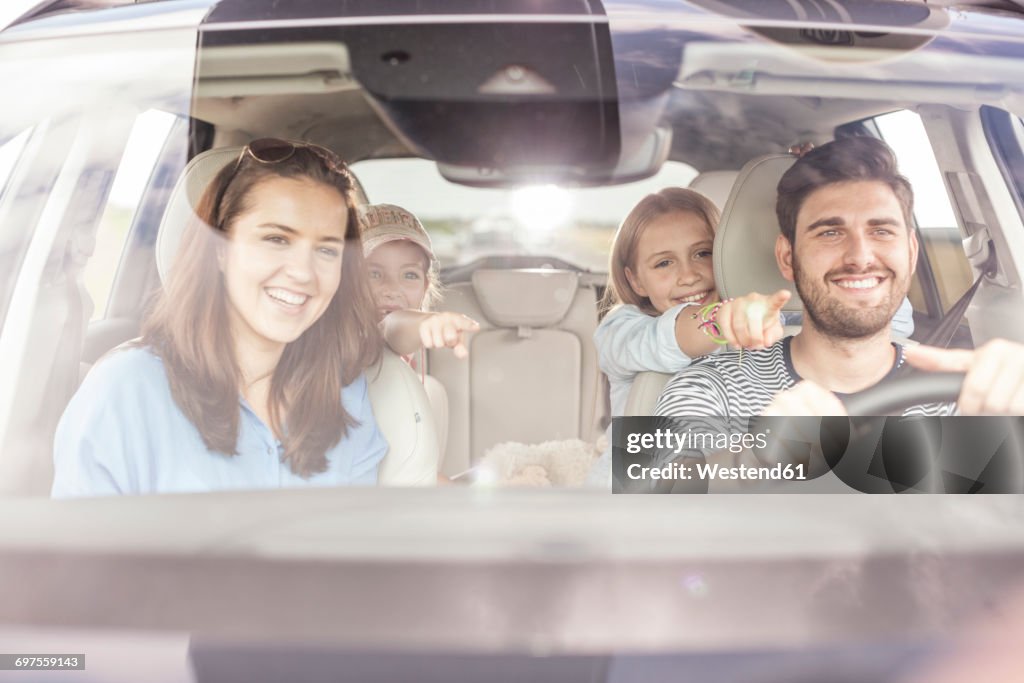 Happy family doing a road trip