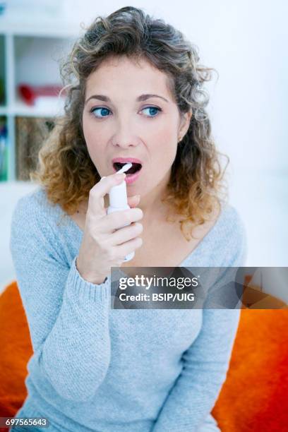 Using Mouth Spray 105 Sore Throat Spray Stock Photos, High-Res Pictures, and Images ...