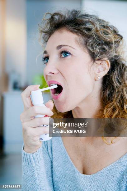 Using Mouth Spray 298 Woman Spray Mouth Stock Photos, High-Res Pictures, and Images ...