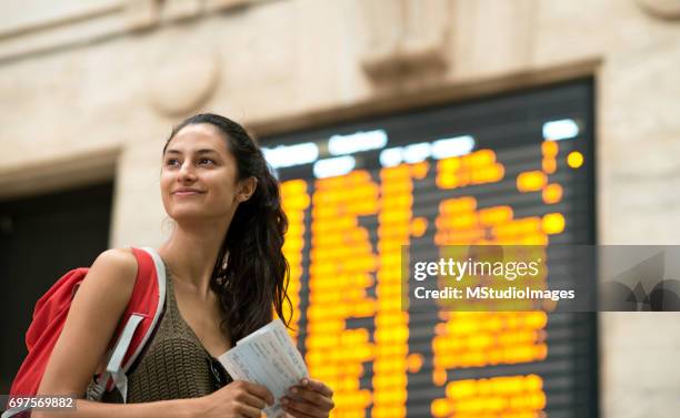 beautiful woman at the train station. - train arrival stock pictures, royalty-free photos & images