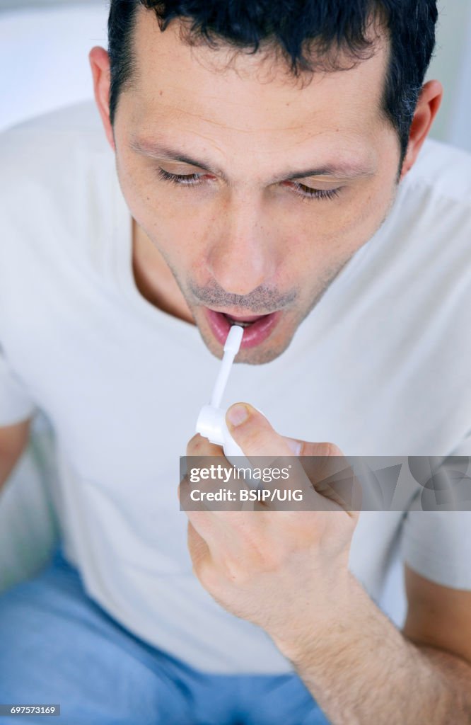 Using Mouth Spray Man Using Mouth Spray High-Res Stock Photo - Getty Images