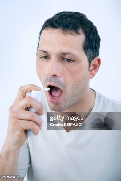 Using Mouth Spray 38 Man Mouth Spray Stock Photos, High-Res Pictures, and Images - Getty ...