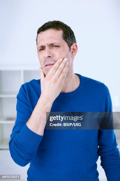 man with toothache - bruxism stock pictures, royalty-free photos & images