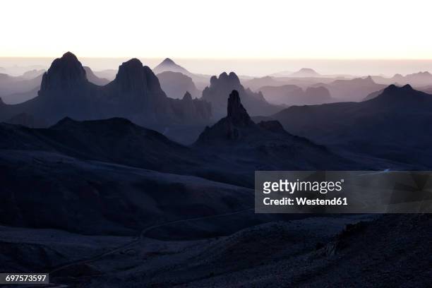 algeria, wilaya tamanrasset, hoggar mountains, assekrem in the mist - sahara　sunrise stock pictures, royalty-free photos & images