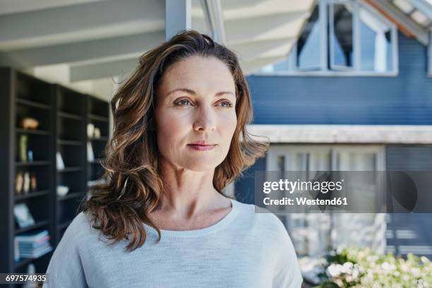 woman at home, portrait - thinking of buying a new home stock pictures, royalty-free photos & images