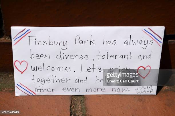 Message is left amongst flowers and tributes outside Finsbury Park mosque near the scene of a terror attack in Finsbury Park in the early hours of...
