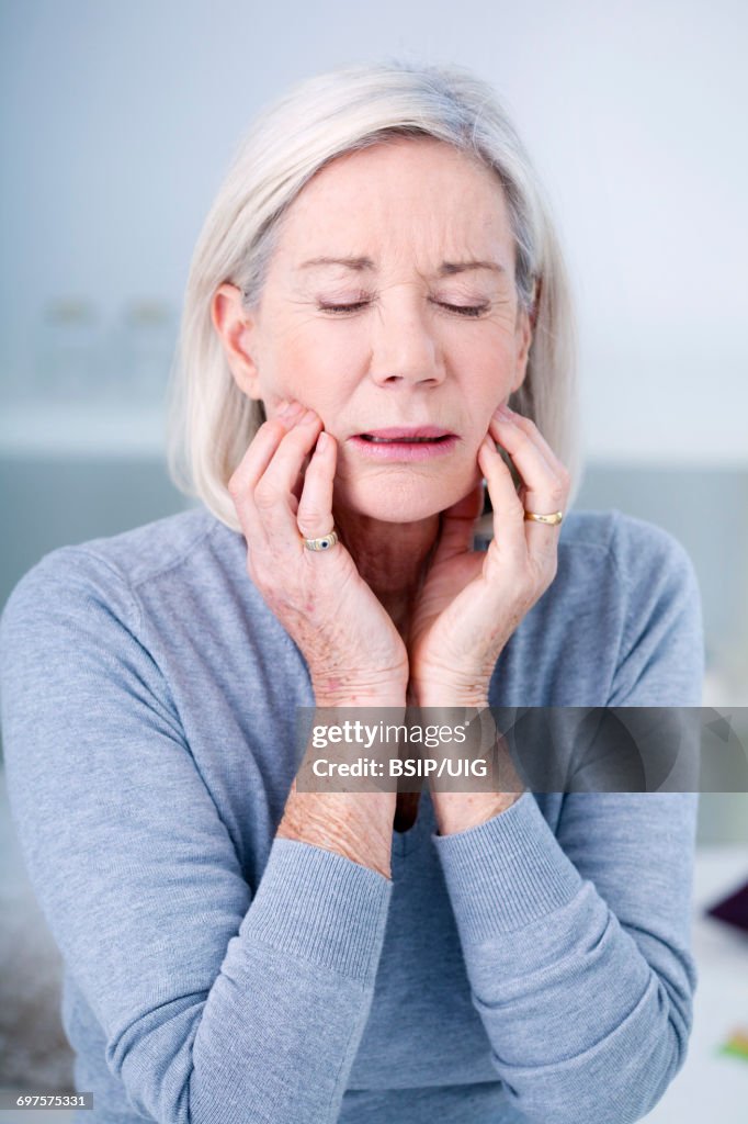 Elderly person with a toothache