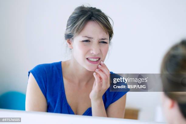 woman with a toothache - bruxism stock pictures, royalty-free photos & images