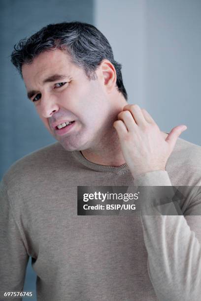 itching in a man - guy scratching stock pictures, royalty-free photos & images