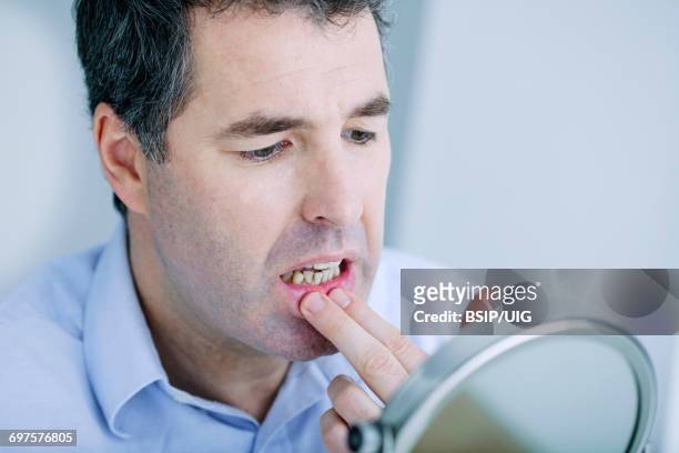 man with mirror - gingivitis stock pictures, royalty-free photos & images