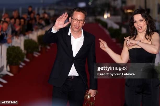 Reda Kateb and Juliette Binoche attend the Winners' Red Carpet after the closing ceremony of 31st Cabourg Film Festival on June 17, 2017 in Cabourg,...