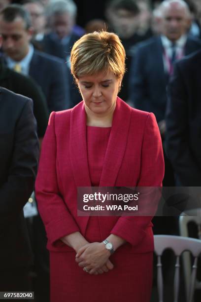 First Minister Nicola Sturgeon observes a minute's silence during a visit to the Advanced Forming Research Centre in Renfrew, Glasgow, in memory of...