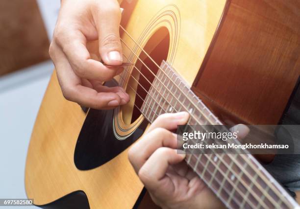 man playing guitar at home. - akustisk gitarr bildbanksfoton och bilder