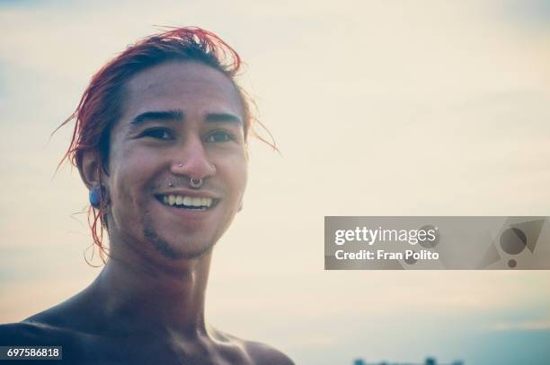a portrait of a young man at the beach. - long beach new york stockfoto's en -beelden