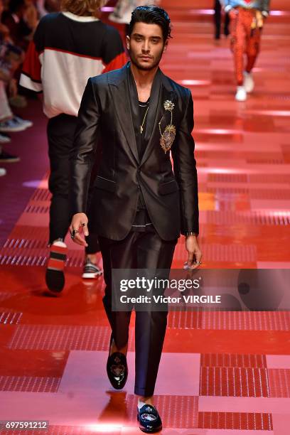 Toni Mahfud walks the runway at the Dolce & Gabbana show during Milan Men's Fashion Week Spring/Summer 2018 on June 17, 2017 in Milan, Italy.