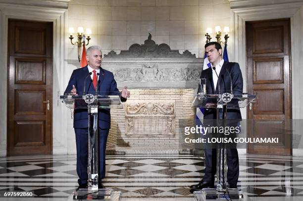 Turkish Prime Minister Binali Yildirim and Greek Prime Minister Alexis Tsipras give a press conference in Athens on June 19, 2017. Yildirim visits...