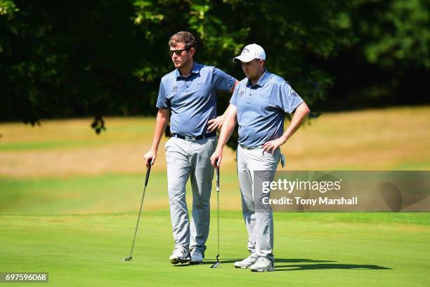 Laurence Allen and Joel Saunders of Verulam Golf Club wait to putt on the 14th green during the Golfbreaks.com PGA Fourball Championship East...