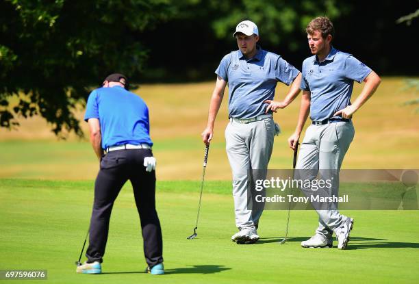 Laurence Allen and Joel Saunders of Verulam Golf Club wait to putt on the 14th green during the Golfbreaks.com PGA Fourball Championship East...