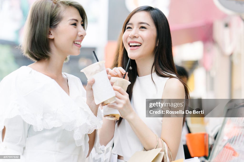 Women friends out for shopping in Bangkok city streets