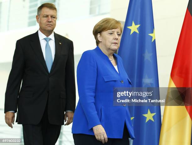 German Chancellor Angela Merkel and Romanian president Klaus Iohannis speak during a press conference following their meeting in the german...