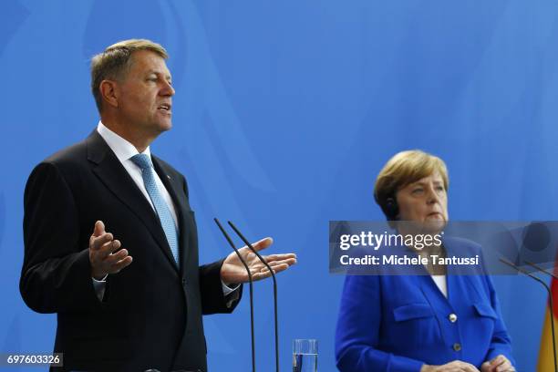 German Chancellor Angela Merkel and Romanian president Klaus Iohannis speak during a press conference following their meeting in the german...